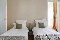 pristine bed sheets and pillows in République - Voltaire luxury apartment