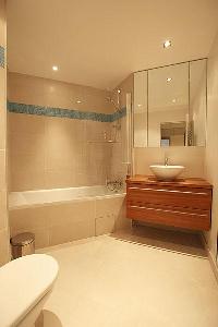 elegant bathroom with tub in Passy La Tour luxury apartment