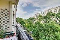 views outside from the wide and bright balcony in a 1-bedroom Paris luxury apartment