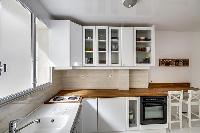spacious well-equipped kitchen in a 1-bedroom Paris luxury apartment